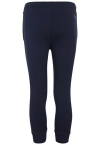 Pantaloni sportivi attillati blu navy con polsini e girovita a costine. Presentano tasche laterali e un piccolo logo sulla parte superiore della schiena. Materiale in cotone.