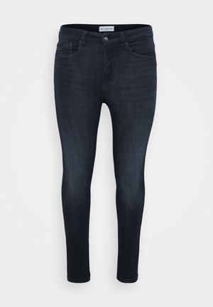 Dark blue skinny jeans with a smooth texture, featuring a classic five-pocket design and a zip fly with button closure.