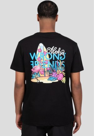 Black cotton t-shirt featuring colorful graphic print of surfboards, flamingo, and flowers with the text "Aloha Wrong Friends" on the back.