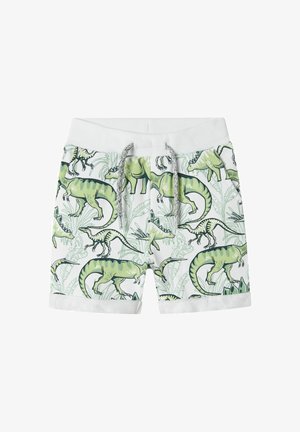 Green and white shorts with dinosaur print, featuring an elastic waistband and drawstring. Rolled cuffs and a lightweight fabric texture.