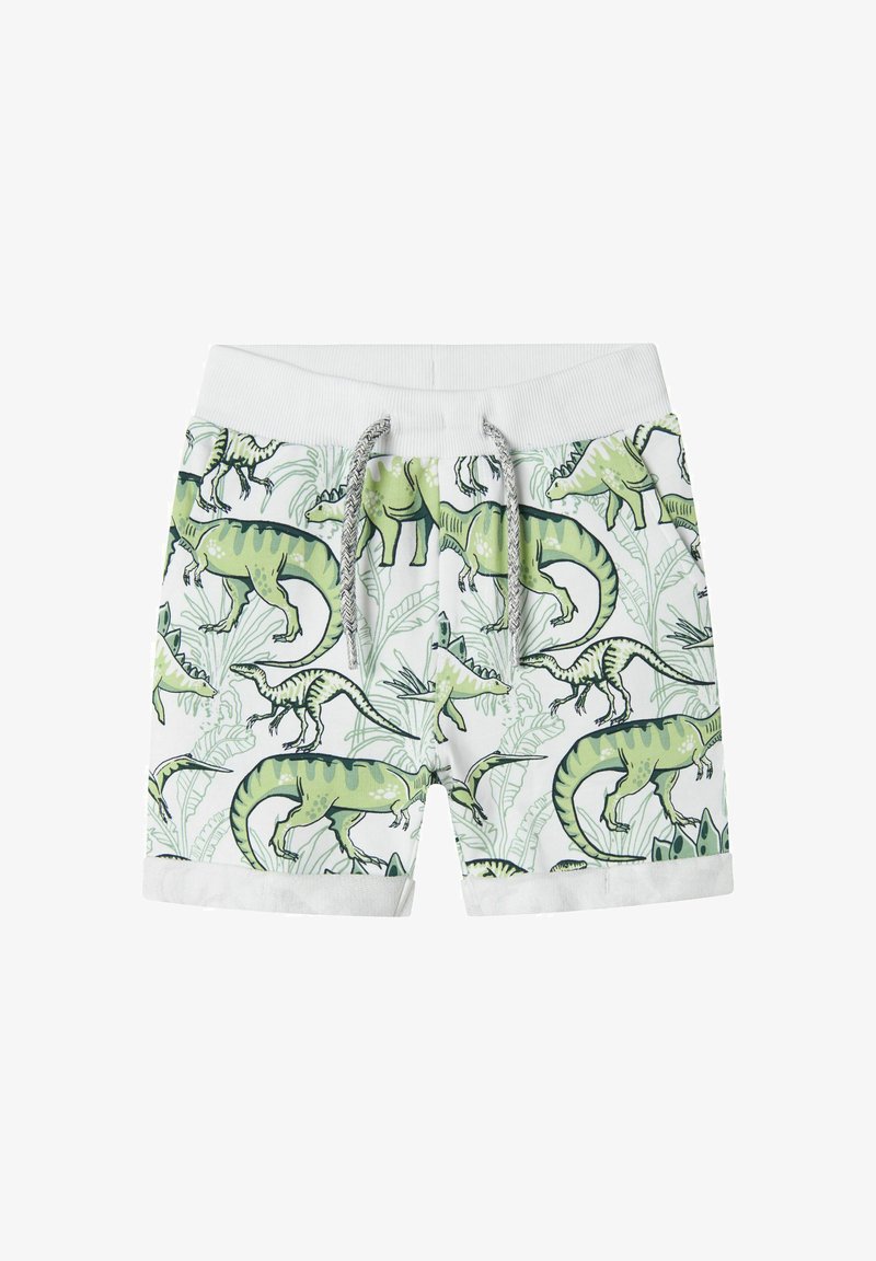 Zelené a biele kraťasy s potlačou dinosaurov, s elastickým pásom a šnúrkou na stiahnutie. Otočené manžety a ľahký textilný štruktúra.