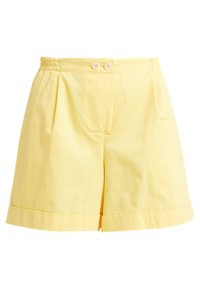 Žluté bavlněné šortky s sklady na přední straně, dvěma knoflíkovými zapínáními a ohrnutými manžetami. Hladká struktura a uvolněný střih.