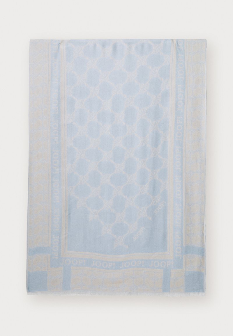 Tissu bleu clair avec un motif floral subtil et le texte « JOOP! » répété le long de la bordure.