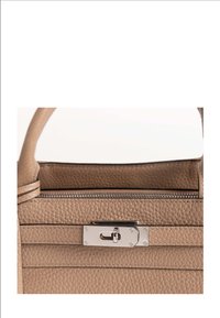 Beige leather handbag with a textured surface, featuring a silver clasp hardware and a zip closure. Short handle for easy carrying.