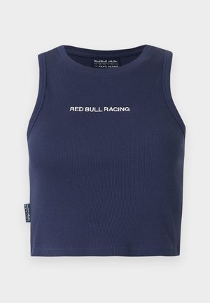 Tumesinine varrukateta lühike top, mille rinnal on valge kirjaga "RED BULL RACING" tikitud, soonikust kangas ja väike küljetäht.