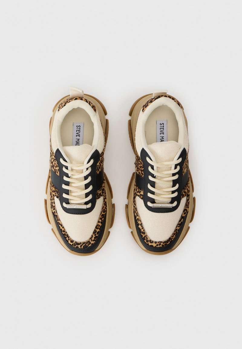 Sneakers con una toma superiore in rete beige, accenti in pelle nera e un design a stampa leopardata. Suola in gomma spessa per una maggiore trazione e comfort.