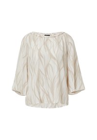 Beige Bluse mit einem Blattmuster, aus leichtem Stoff. Sie hat einen weiten Ausschnitt und Ballonärmel.