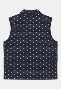 Námořnická modrá péřová vesta s bílými puntíky, s límečkem, bez rukávů a prošívanou strukturou pro izolaci.