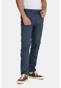 Navy blue tapered pants made of lightweight fabric, featuring an elastic waistband with a drawstring and side pockets.