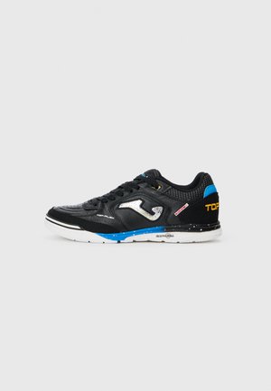Black athletic shoe with a textured leather upper, white outsole featuring blue accents, and a silver logo on the side. 'TOPFLEX' text in yellow.