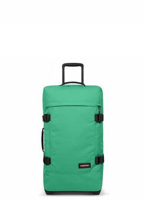 Green fabric wheeled duffle bag with a retractable handle, front pocket, and black straps. Features sturdy base and branded label.