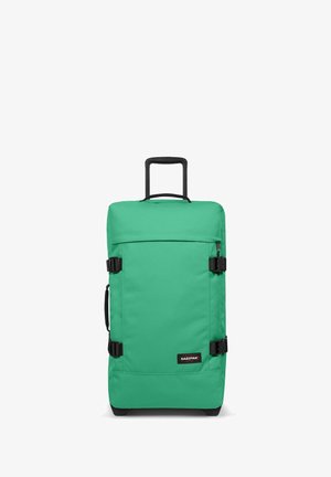 Green fabric wheeled duffle bag with a retractable handle, front pocket, and black straps. Features sturdy base and branded label.