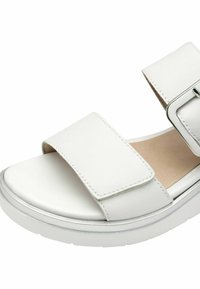 Sandale blanche avec deux brides réglables, matériau en similicuir lisse, semelle compensée et accent métallique sur le bord.