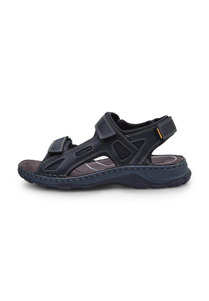 Mustad mustad sandaalid mitme Velcro rihmaga, avatud külgedega, tekstuuriga sisetald ja tugev kummist välistald. Nähtav õmblus lisab detaili.
