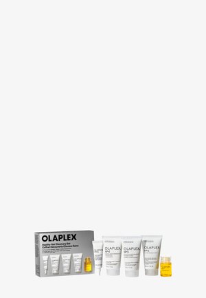Olaplex Healthy Hair Discovery Set med seks hårplejeprodukter, herunder shampooer, balsam, bond smoother, hovedbundsserum og bondingolie.