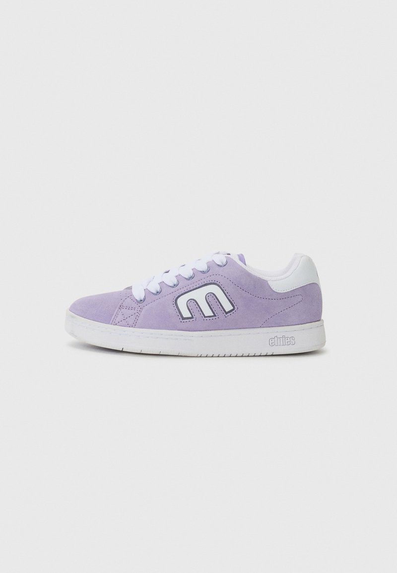 Purple suede sneaker featuring a white rubber sole, white laces, and a prominent logo on the side in contrasting white outline.