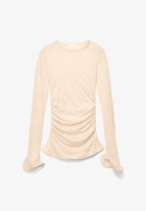 Ilgas rankovėmis smėlio spalvos palaidinė su raukiniais, apvalia iškirpte ir šiek tiek praplatėjusiais rankogaliais, išdėstyta horizontaliai ant balto fono.