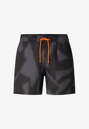 Short de bain noir avec une taille élastique et un cordon de serrage orange vif à l'avant.