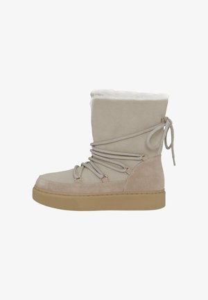 Tan suede ankle boots with a fur-lined collar, decorative laces, and rubber soles; features gold-tone hardware and contrasting shades.