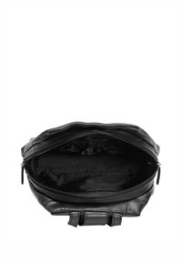 Black leather bag with a zipper opening, showcasing a spacious interior lined with a logo-patterned fabric, featuring dual handles and a soft texture.