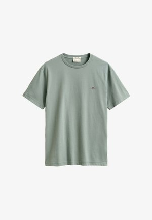 Svetlozelené krátky rukáv bavlnené tričko s okrúhlym výstrihom a malým vyšívaným logom na ľavej strane hrudníka.