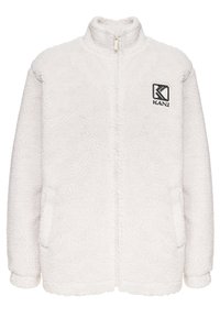 Vit fuskpälsjacka med hög krage, framzip, sidofickor och broderad "KANI"-logotyp. Mjuk textur och avslappnad passform.
