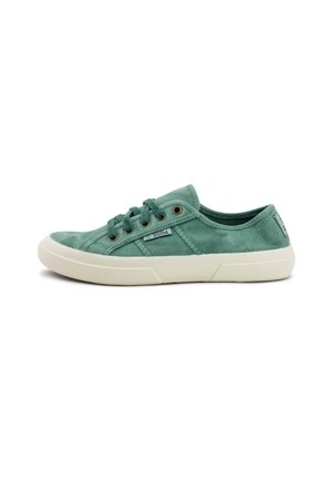 Green canvas sneakers with white rubber soles, featuring metal eyelets, laces, and a textured upper. Accented with a logo tag.