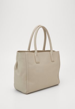 Sac fourre-tout en cuir beige avec deux poignées arrondies, forme rectangulaire et coutures visibles sur les côtés, posé sur une surface blanche.