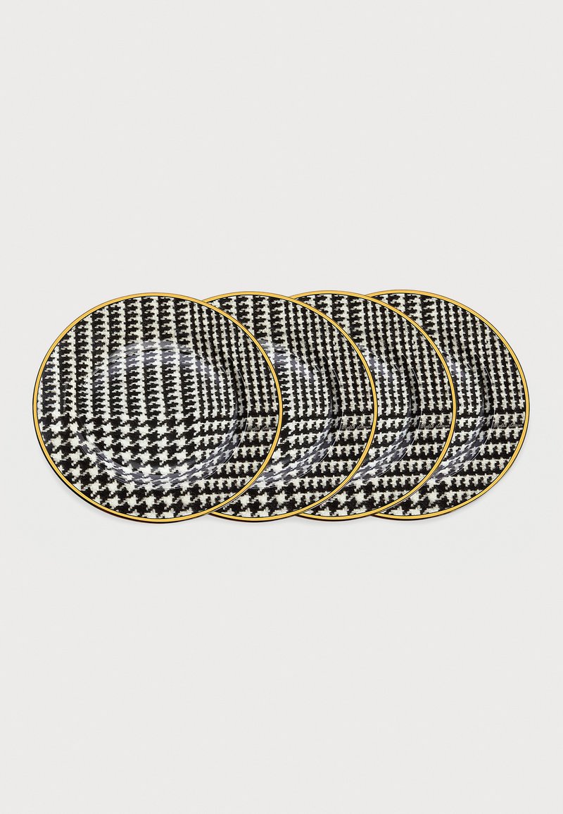 Set med fyra keramiska tallrikar som har ett svart och vitt houndstooth-mönster med en gyllene kant. Rund form med en glänsande yta.