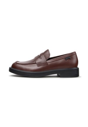 Brown leather penny loafer with black sole, low heel, and stitched detailing, viewed from the side on a white background.