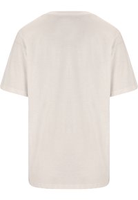 Kortärmad t-shirt i ljusbeige bomull med rund hals och en slät, mjuk textur; enkel baksida utan mönster eller detaljer.