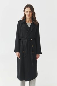 Black trench coat with a belted waist, double-breasted front, and large buttons. Features long sleeves and a classic lapel design.