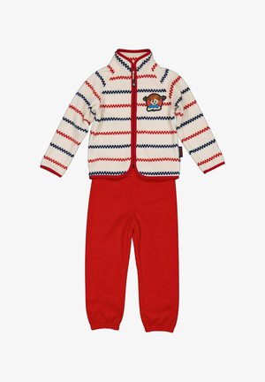 Lasten fleecenäyttö, jossa on punaiset housut ja valkoinen vetoketjullinen takki, jossa on punaisia ja laivastonsinisiä siksak-raidat sekä tytön kasvojen kirjain rinnassa.