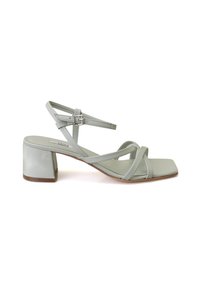 Strap-sandalen mit Blockabsatz aus hellgrünem Leder, mit überkreuzten Riemen und einem quadratischen Zehenbereich in glatter Textur.