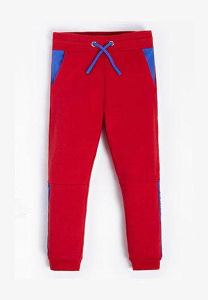AKTIV SEITLICHES LOGO - Pantaloni sportivi - rot