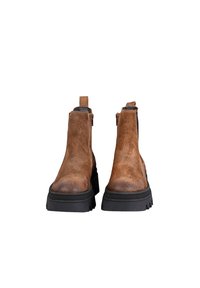 Brown suede ankle boots with a textured surface, black rubber sole, and side zippers; includes back pull tabs for easy wear.