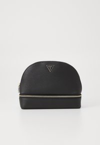 Borsa cosmetica sintetica nera con una parte superiore curva, hardware dorato e superficie testurizzata. Presenta un logo triangolare prominente e una chiusura con zip.