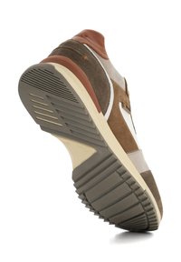 Brown and beige sneaker showing a textured upper with suede and leather accents, rubber sole with a patterned tread, and a cushioned collar.