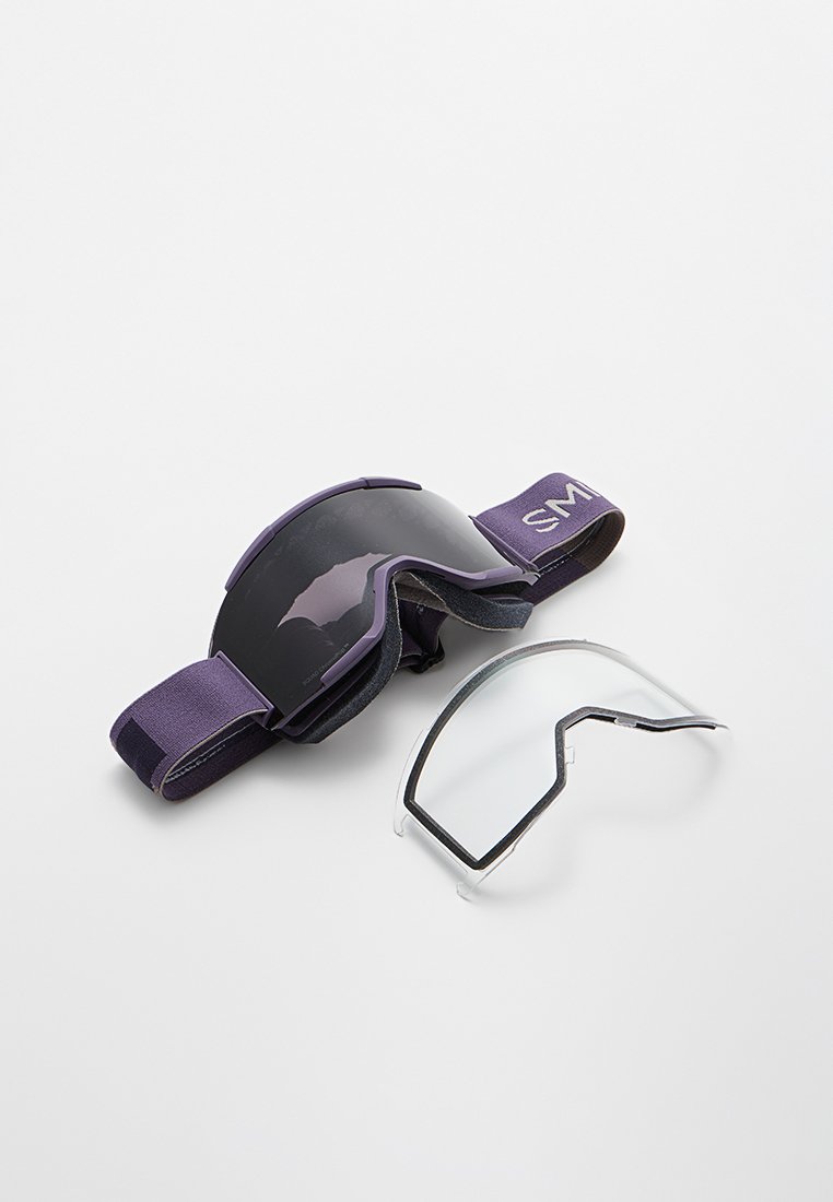 Skibrille mit einem dunkellila Rahmen und Band. Enthält ein klares abnehmbares Glas. Texturiertes Band für sicheren Sitz.