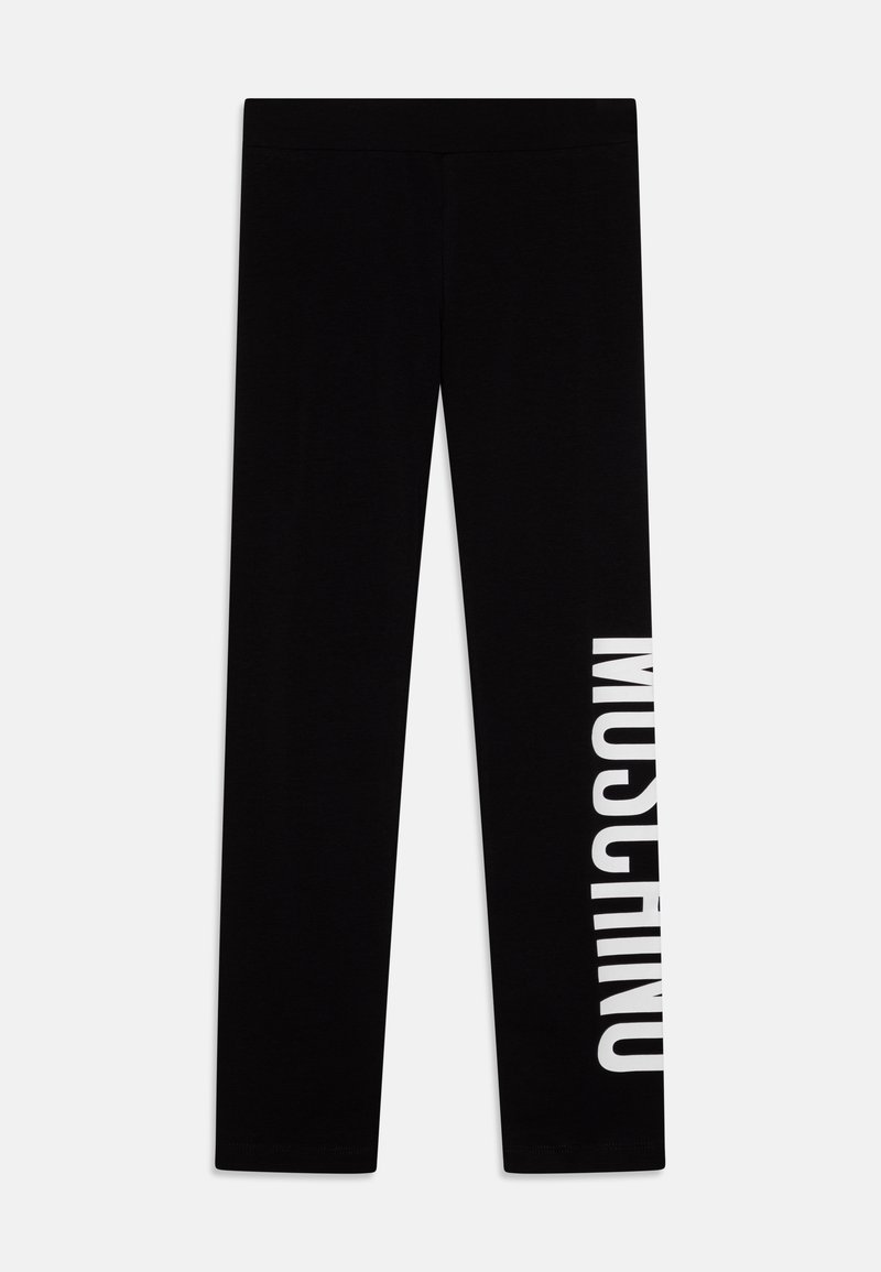 Black leggings made of soft fabric, featuring a white "MOSCHINO" logo printed vertically along the left leg. Simple, slim-fit design.