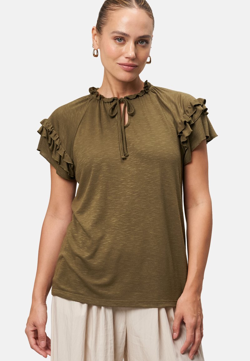 Olive green short-sleeve top with ruffled accents, keyhole neckline with tie detail, made from soft, textured fabric. Simple and relaxed fit.