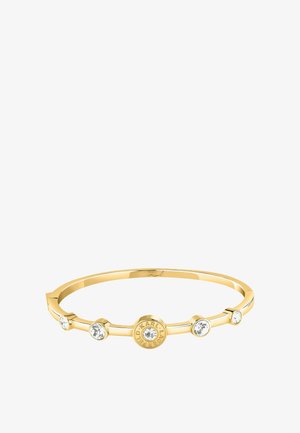 Gold bangle bracelet with five clear crystals, one centered in a round charm engraved with "KARL LAGERFELD."