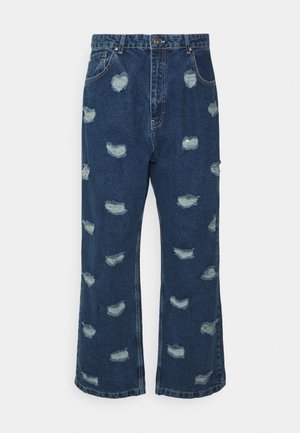 Siniset farkut leveällä lahkeella, joissa on kulutetut päällysteet, frayed-reunat ja klassinen viisi-taskuinen muotoilu. Viimeistelemätön helma.