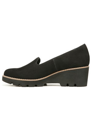 Black, suede wedge shoe with a smooth finish, rounded toe, and textured sole. Features a low-cut vamp and a light-colored accent around the sole.