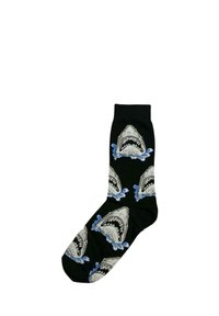 Chaussette noire à motif de têtes de requins grises à bouche ouverte, répétées, émergeant de éclaboussures bleues.