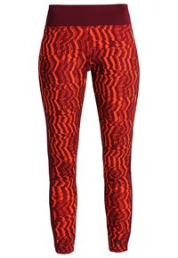 Legginsy w czerwono-pomarańczowy wzór z szerokim ciemnoczerwonym pasem w talii, charakteryzujące się dynamicznym, abstrakcyjnym wzorem i gładką teksturą.