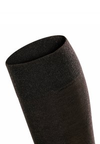 Zwarte, gestructureerde sok met een ribgebreid boord, een gladde schacht en een naadloos ontwerp. Het materiaal lijkt rekbaar en comfortabel om te dragen.