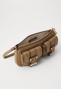 Brown leather bag featuring a zip top, two front pockets with buckle accents, and a gold-tone hardware detail. Textured finish.