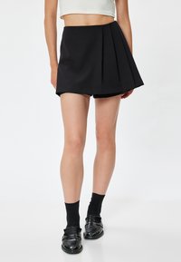 Falda acampanada - black