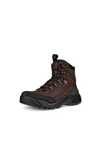 Bota de senderismo marrón con parte superior de cuero y ante, suela de goma, ojales de metal y puntera reforzada. Diseñada para estabilidad y tracción en el uso al aire libre.